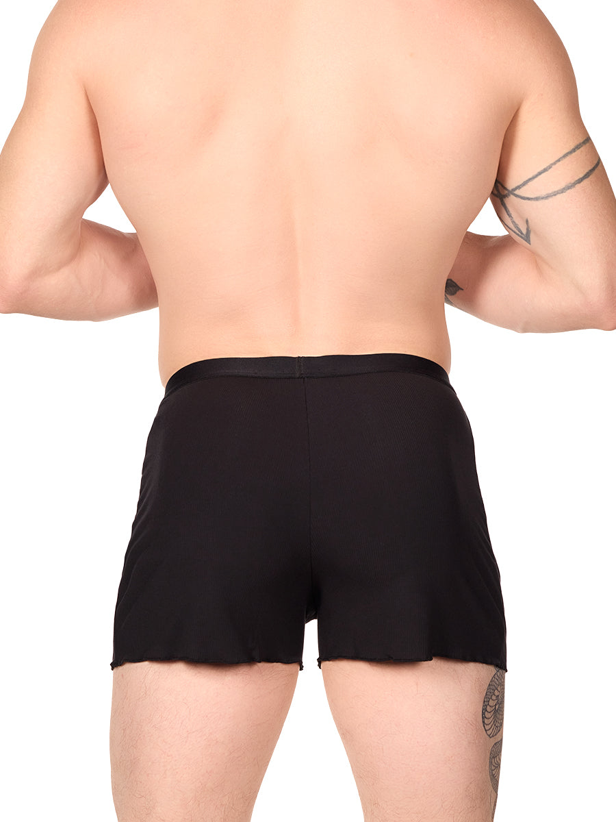 Back view of a man wearing black XDress lounge shorts