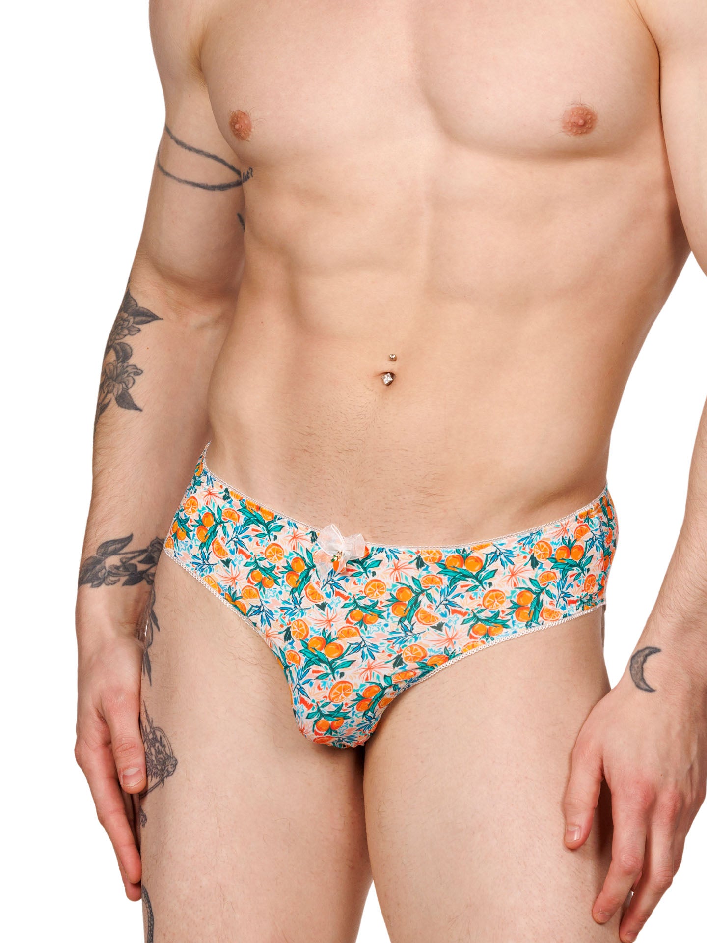 Front view of a male model wearing XDress men's panties with a vibrant orange blossom pattern.
