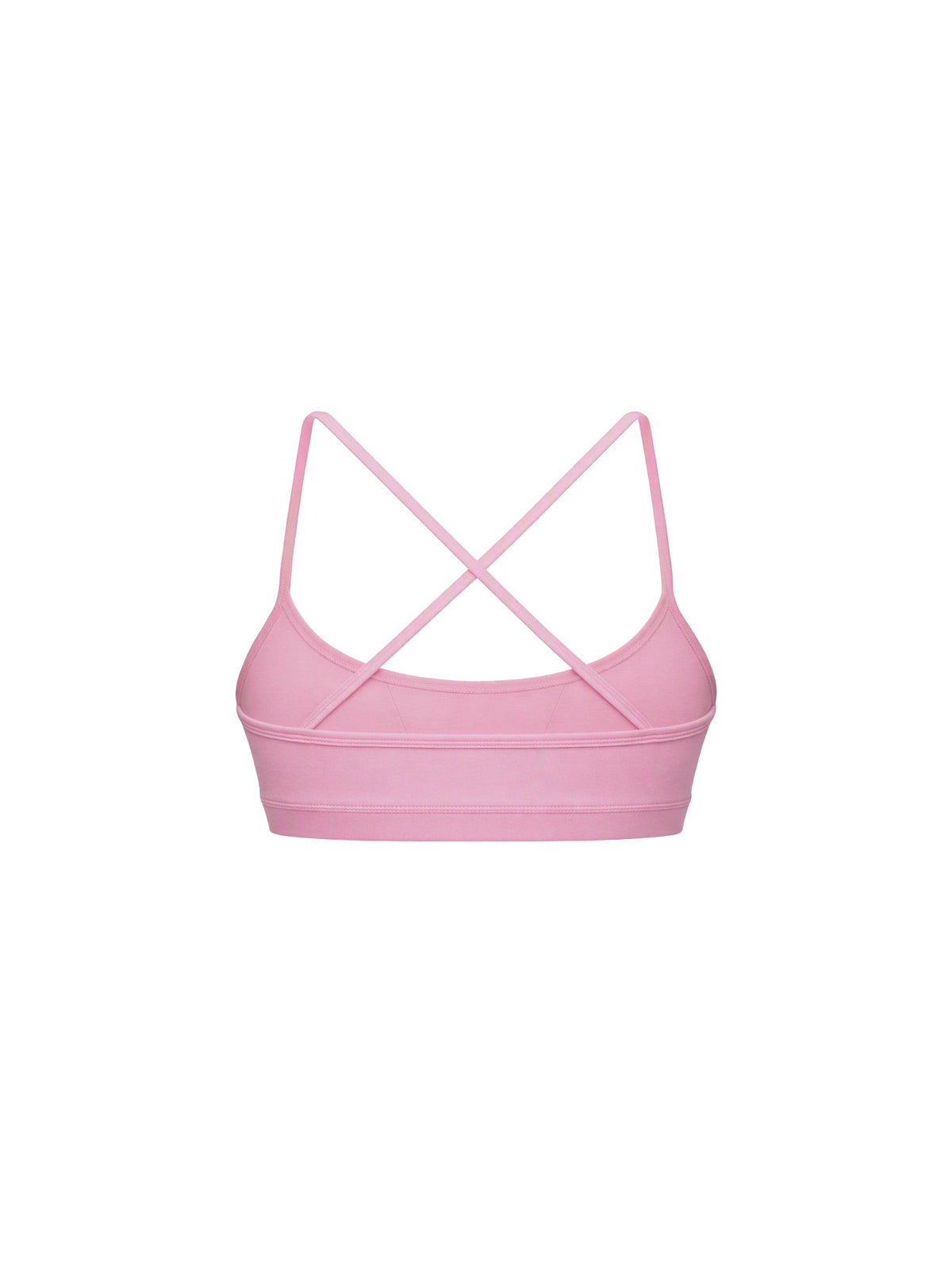 A light pink sports bra with thin crisscrossing shoulder straps, shown from the back on a solid white background.