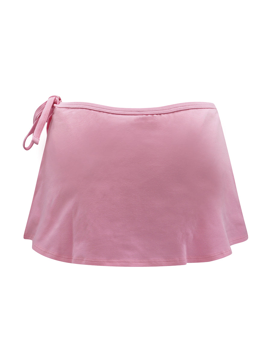 Back view of a pink skort on a white background.