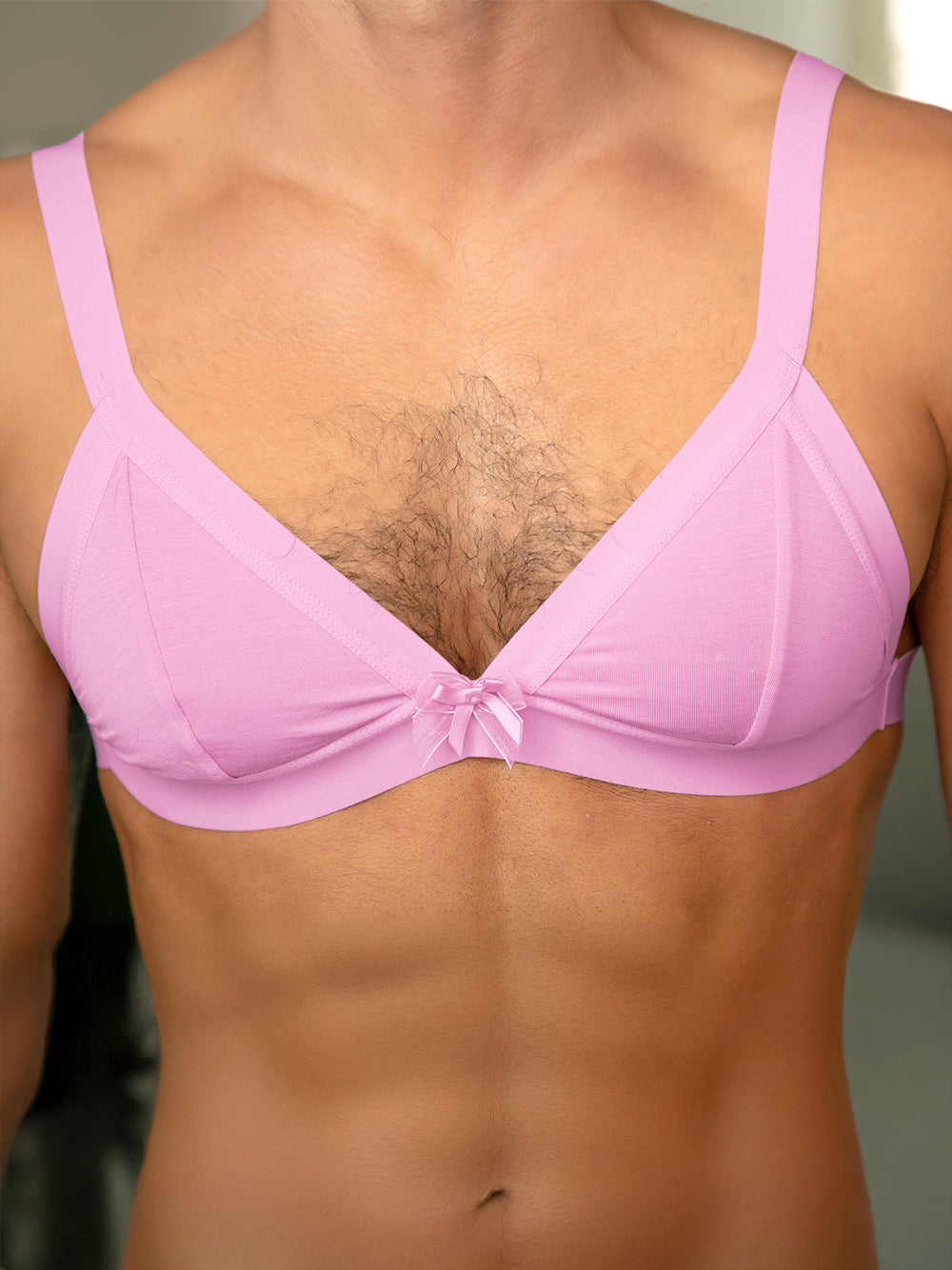 Closeup view of a man wearing a purple XDress bra