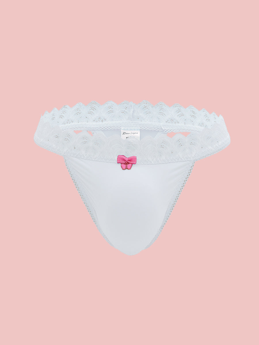 White lace trimmed thong panty on a pink background.