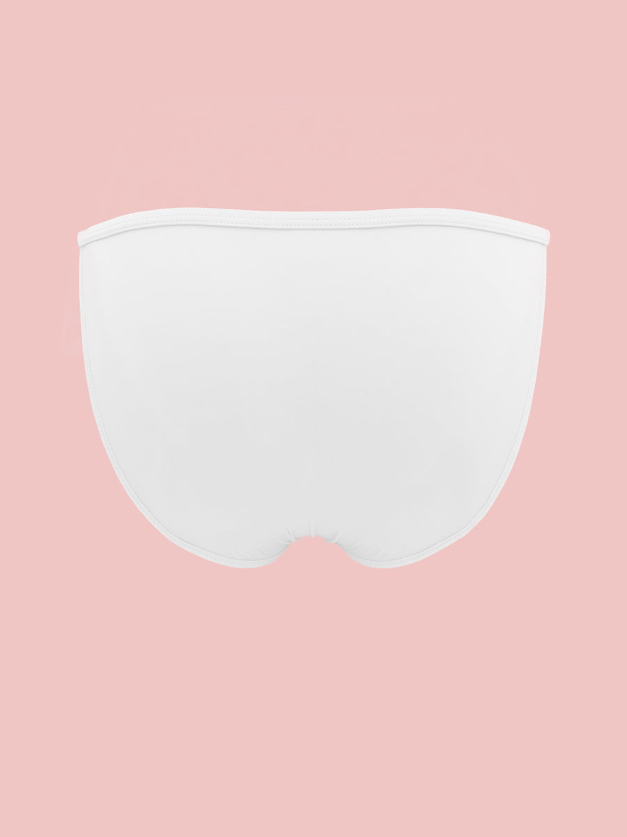 White XDress men's panties on a pink background.