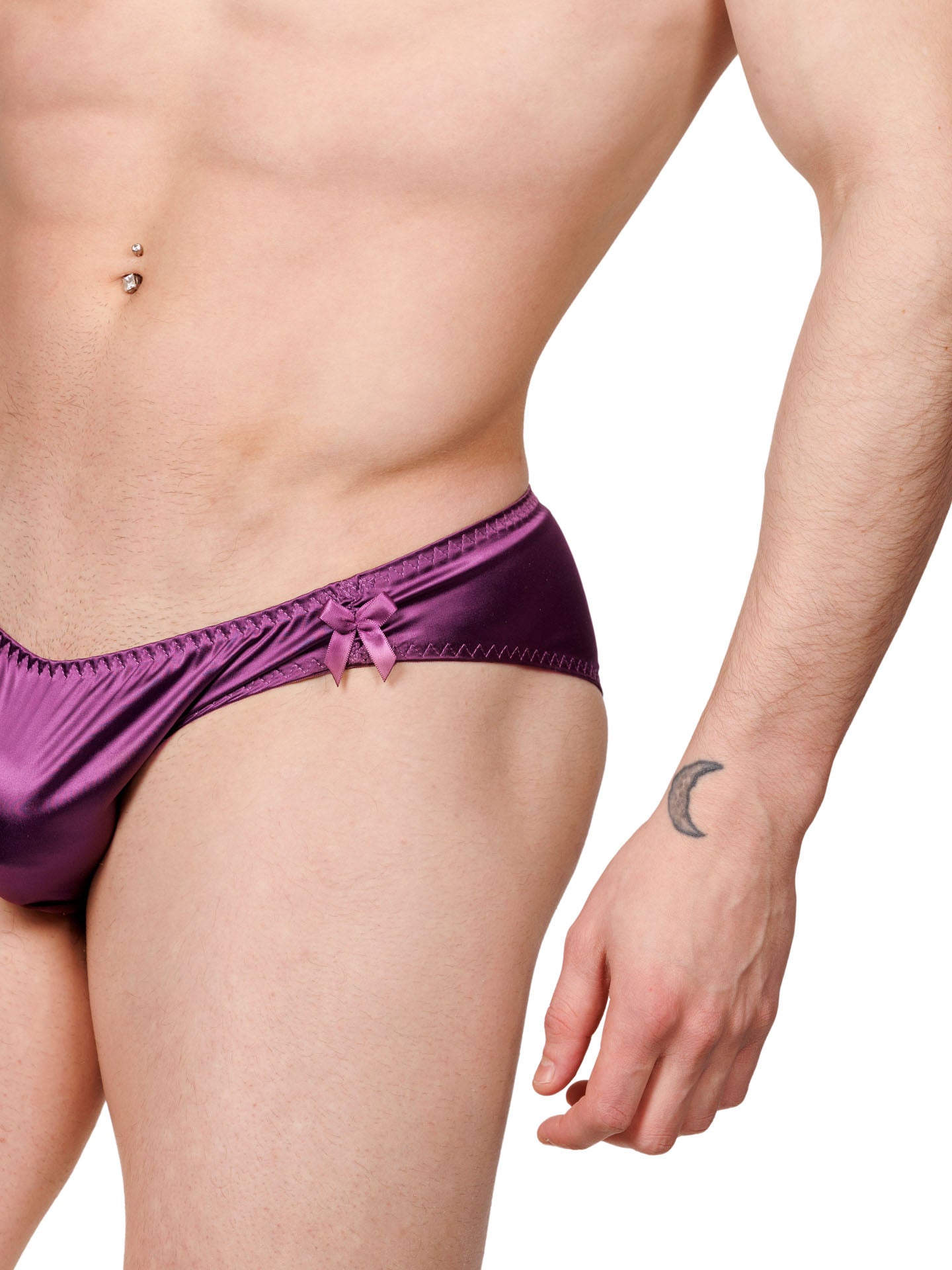 Closeup view of a male model wearing purple XDress panties showing bow detail