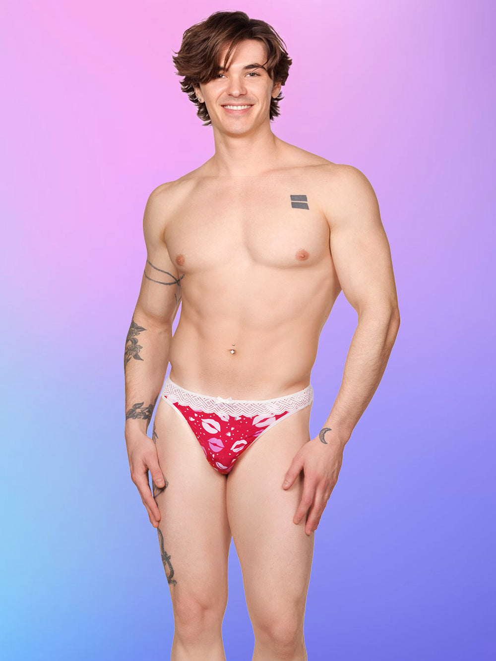 Front view of a male model wearing an XDress red and white thong with lipstick kisses pattern and lace waistband