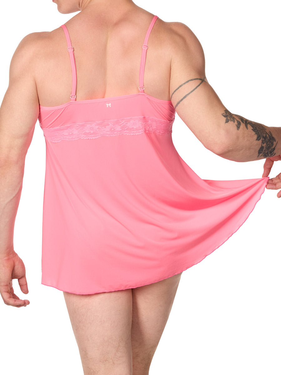 back view of man in an XDress pink babydoll lingerie holding up the hem