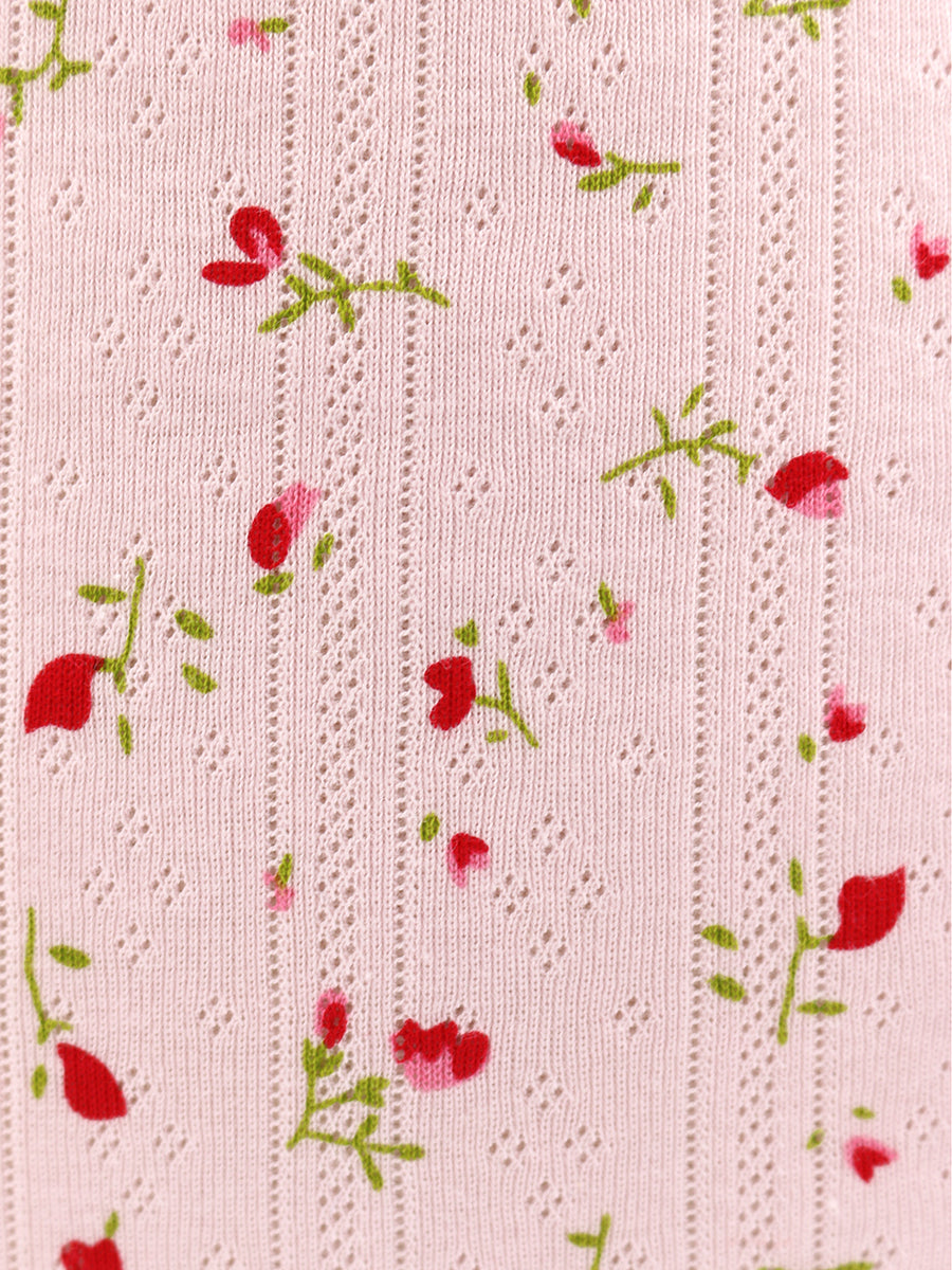 Pink fabric with red floral pattern