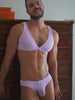 Video of a man posing in a matching purple bra and panty set from XDress.
