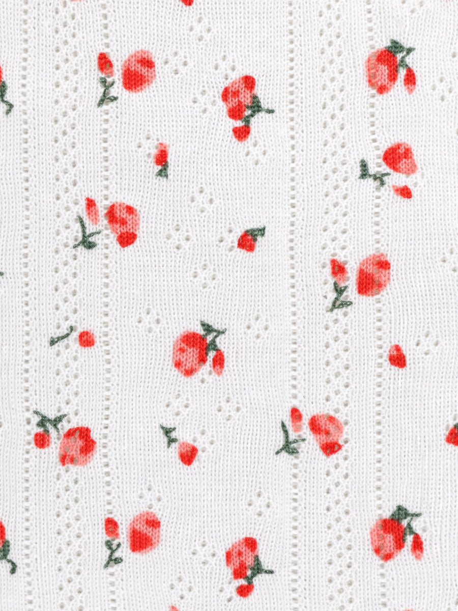 White textured fabric with red floral pattern